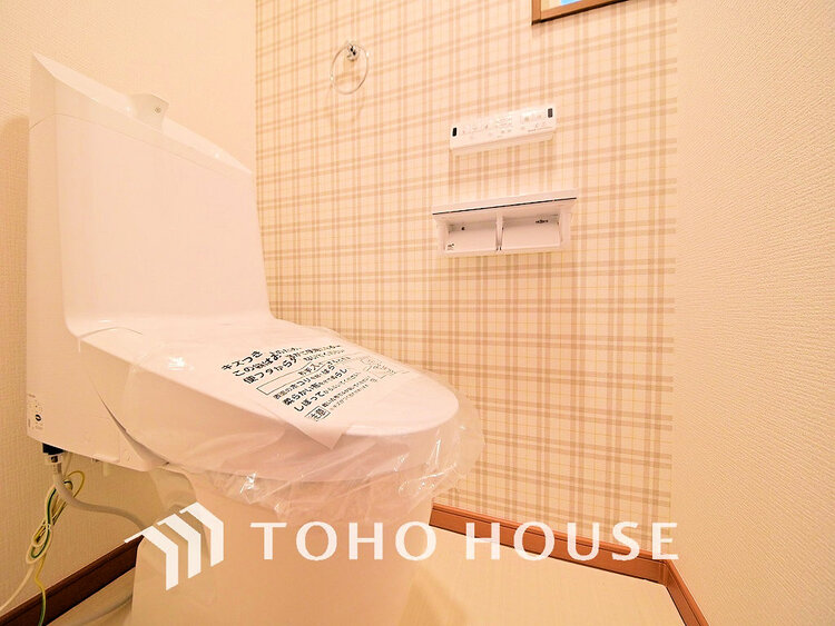 トイレ 白いクロスにより清潔感のあるトイレ