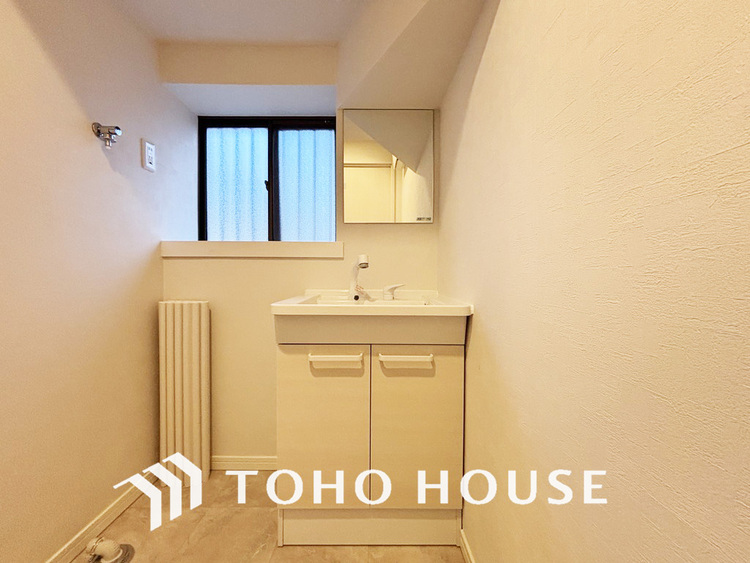 洗面 白を基調とした清潔感のある洗面室