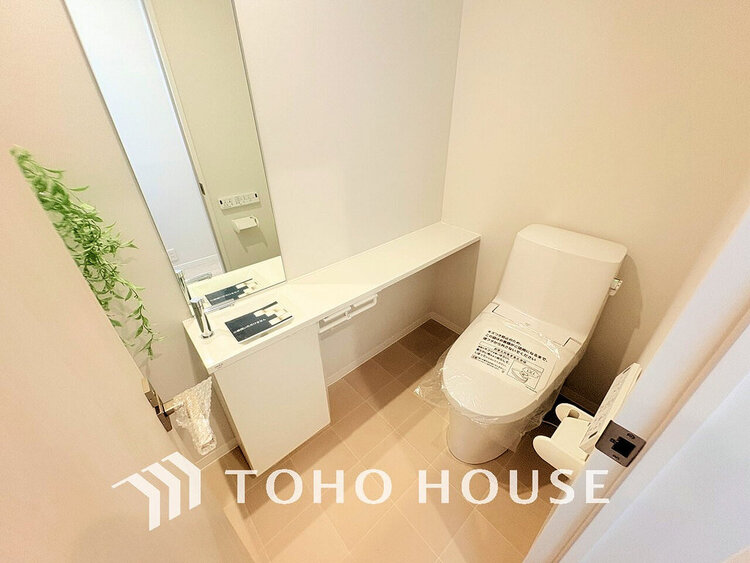 トイレ 白いクロスにより清潔感のあるトイレ