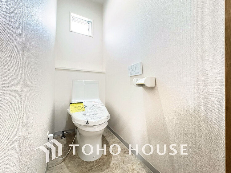 トイレ 白いクロスにより清潔感のあるトイレ