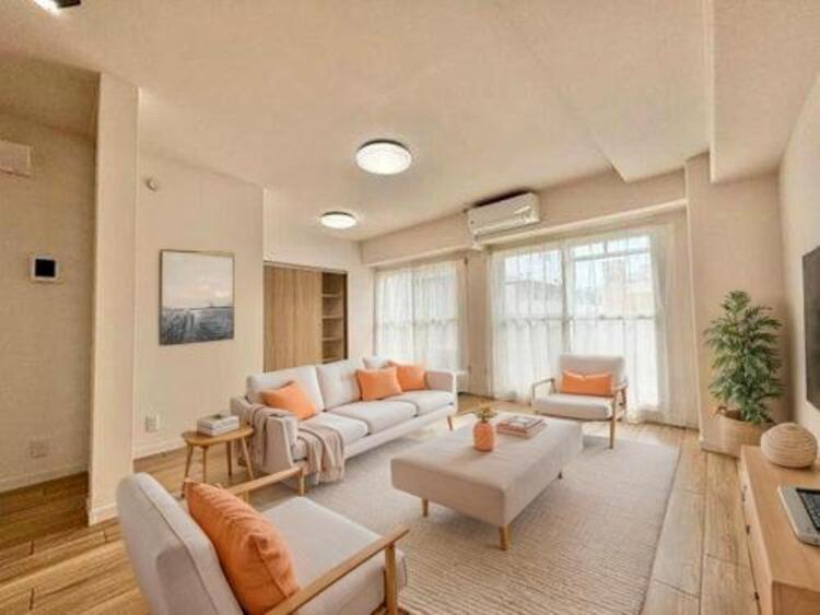 居間 リビング（配置してある家具はCGによるイメージです）家族が集まるリビングは明るさが取れる設計に。続き間の洋室はお子様を遊ばせるスペースとしても重宝します。ライフスタイルの変化にも対応しやすい間取り設計にしました