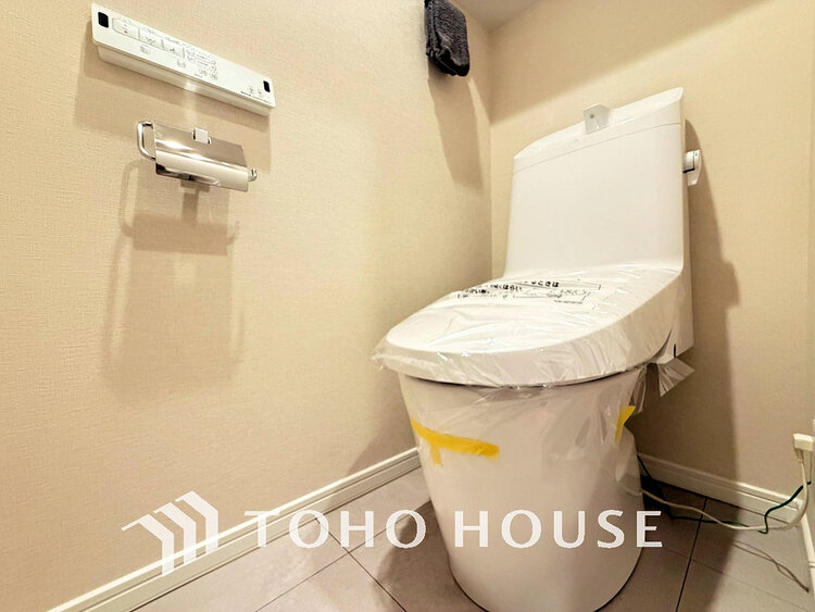 トイレ 白いクロスにより清潔感のあるトイレ